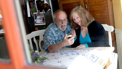 Allan and Debbie Cameron contact their grandchildren via the internet, March 25, 2020, in Chandler, Ariz.