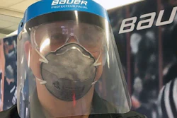 A Bauer employee models a medical face shield, Blainville, Quebec, March 23, 2020.