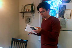 Neuroscientist Michael Wells works on the COVID-19 Pandemic Shareable Scientist Response Database in his home in Cambridge, Mass., March 25, 2020.