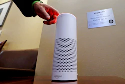 In this May 17, 2017, file photo, an Amazon Alexa device is switched on for a demonstration of its use in a ballpark suite before a Seattle Mariners baseball game in Seattle.
