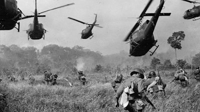 U.S. Army helicopters cover the advance of ground troops near the Cambodian border, March 1965.