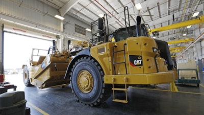 A Caterpillar grader awaits modification at Puckett Machinery Company in Flowood, Miss., Sept. 18, 2019.