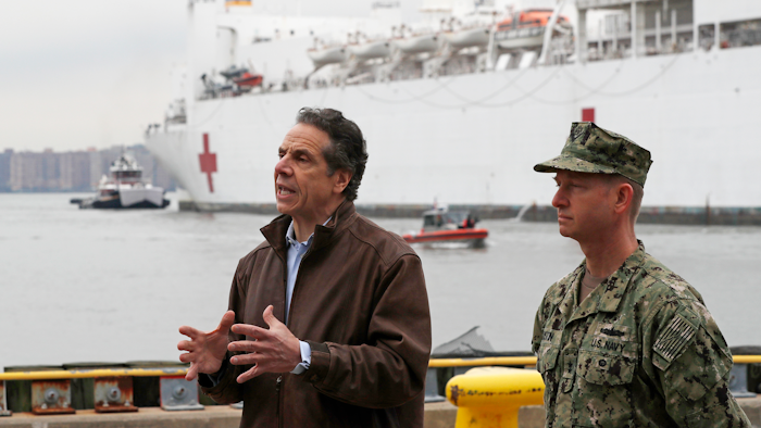 New York Go. Andrew Cuomo, left, with Rear Adm. John B. Mustin after the arrival of the USNS Comfort in New York, March 30, 2020.