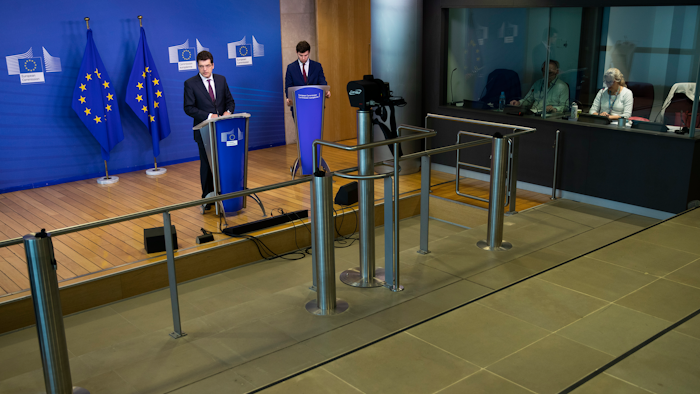 European Commissioner for Crisis Management Janez Lenarcic, left, during a news conference at EU headquarters in Brussels, April 7, 2020.