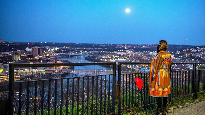 Jena-Anne Sabom looks toward the Pittsburgh skyline from the Mount Washington neighborhood, April 7, 2020.