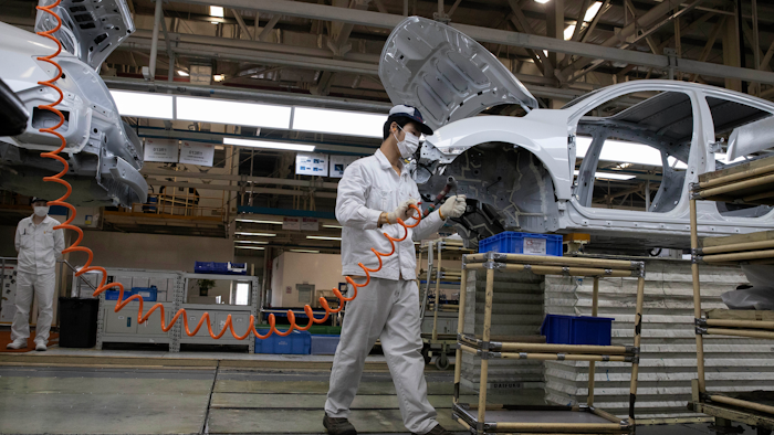 Workers at the Dongfeng Honda Automobile Co. factory in Wuhan, April 8, 2020.
