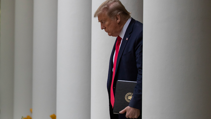 President Donald Trump arrives in the Rose Garden of the White House, April 14, 2020.