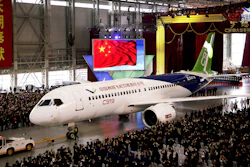 The first COMAC twin-engine, 158-seat C919 passenger plane is pulled out of the company's hangar near the Pudong International Airport, Shanghai, Nov. 2, 2015.