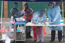 Doctors and nurses at a Mobile Health Unit at Robert C. Byrd Clinic on the campus of the West Virginia School of Osteopathic Medicine, Lewisburg, W.Va., March 24, 2020.