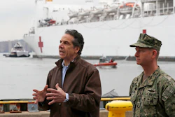 New York Go. Andrew Cuomo, left, with Rear Adm. John B. Mustin after the arrival of the USNS Comfort in New York, March 30, 2020.