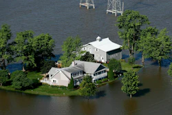 Flood water surrounds a home outside of West Alton, Mo., June 5, 2019.
