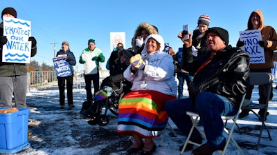 Opponents of the Keystone XL oil pipeline demonstrate in sub-freezing temperatures in Billings, Mont., Oct. 29, 2019.