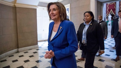 House Speaker Nancy Pelosi walks to her office on Capitol Hill, March 27, 2020.