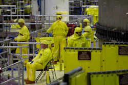 Workers gather near the Unit 2 reactor at the Browns Ferry nuclear plant in Athens, Ala., March 25, 2011.