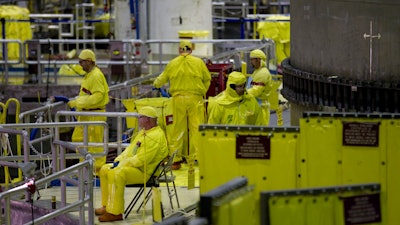 Workers gather near the Unit 2 reactor at the Browns Ferry nuclear plant in Athens, Ala., March 25, 2011.