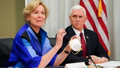 White House coronavirus response coordinator Dr. Deborah Birx and Vice President Mike Pence during a visit to 3M headquarters in Maplewood, Minn., March 5, 2020.
