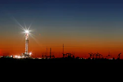 Oil rig lights on the outskirts of Midland, Texas, April 2, 2020.