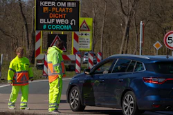 Regulators turn back non-essential traffic on a road leading to the beach resort of Zandvoort, Netherlands, April 4, 2020.