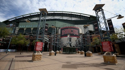 The main entrance in front of Chase Field is devoid of activity in Phoenix, March 26, 2020.