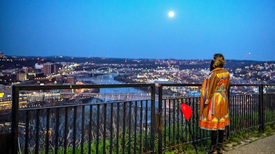 Jena-Anne Sabom looks toward the Pittsburgh skyline from the Mount Washington neighborhood, April 7, 2020.