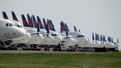 Mothballed Delta Air Lines jets parked at Kansas City International Airport, April 1, 2020.