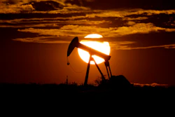 The sun sets behind an idle pump jack near Karnes City, Texas, April 8, 2020.