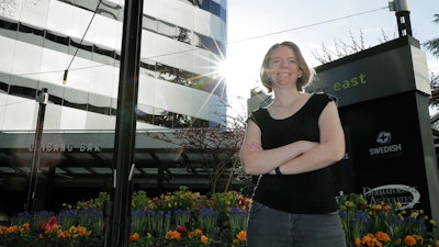 Jennifer Haller, the first patient to receive a shot in the first-stage clinical trial for a COVID-19 vaccine, outside Kaiser Permanente Washington Health Research Institute, Seattle, April 14, 2020.