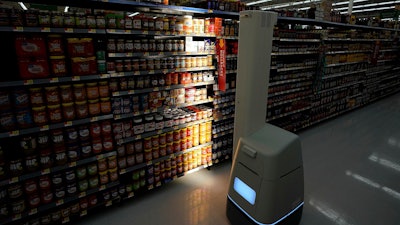 A Bossa Nova robot scans shelves at a Walmart in Houston.