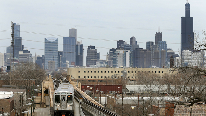 A CTA train travels west away from downtown Chicago, March 23, 2017.