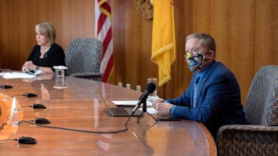 Health and Human Services Secretary Dr. David Scrase gives an update on the COVID-19 outbreak in New Mexico alongside Gov. Michelle Lujan Grisham, April 15, 2020.