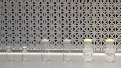 Vials used to prepare syringes in a first-stage trial of a potential vaccine for COVID-19, Kaiser Permanente Washington Health Research Institute, Seattle, March 16, 2020.