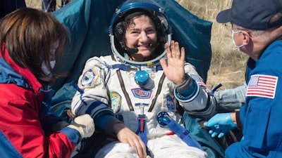 U.S. astronaut Jessica Meir waves after the landing of the Russian Soyuz MS-15 space capsule near Dzhezkazgan, Kazakhstan, April 17, 2020.