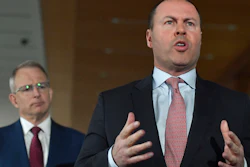 Australia Treasurer Josh Frydenberg, right, with Minister for Communications Paul Fletcher in Canberra, April 20, 2020.