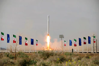 An Iranian rocket carrying a satellite is launched from an undisclosed site believed to be in Iran's Semnan province, April 22, 2020.