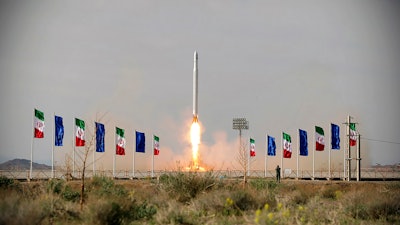 An Iranian rocket carrying a satellite is launched from an undisclosed site believed to be in Iran's Semnan province, April 22, 2020.