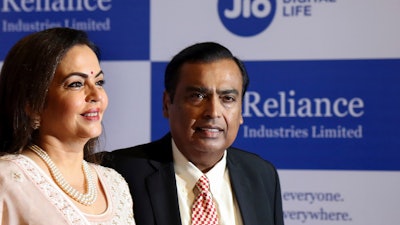 Reliance Industries Chairman Mukesh Ambani and wife Neeta Ambani arrive for the company's annual meeting in Mumbai, Aug. 12, 2019.