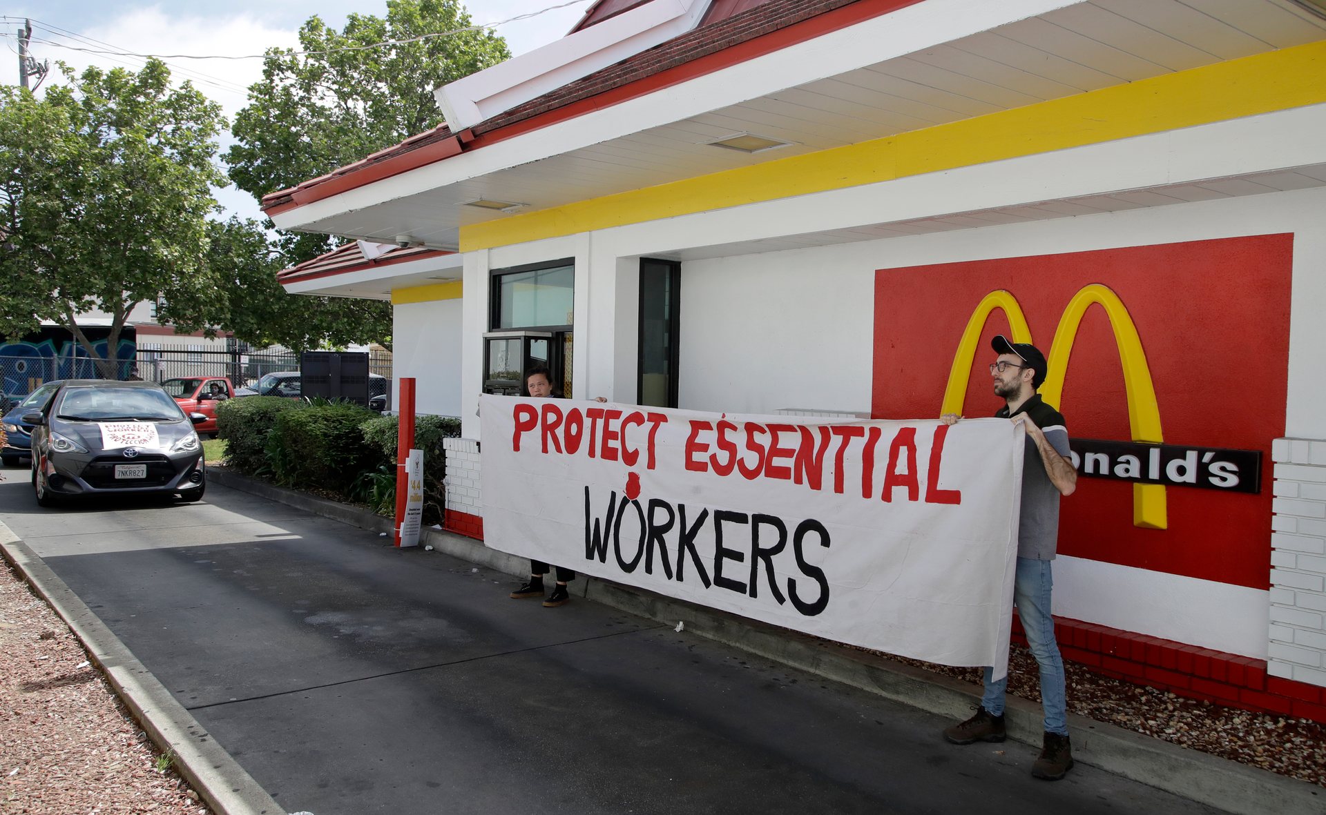 People protest what they say is a lack of personal protective equipment for employees.