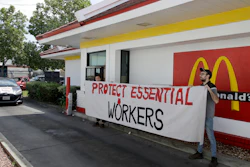 People protest what they say is a lack of personal protective equipment for employees.