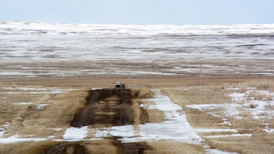 This March 11, 2020 photo provided by the Bureau of Land Management shows the proposed route of the Keystone XL oil pipeline where it crosses into the U.S. from Canada in Phillips County, Mont. A Canadian company said Monday, April 6, 2020, that it's started construction on the long-stalled Keystone XL oil sands pipeline across the U.S.-Canada border, despite calls from tribal leaders and environmentalists to delay the $8 billion project amid the coronavirus pandemic.