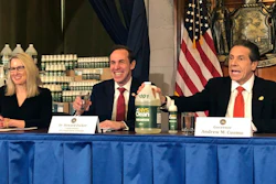 New York Gov. Andrew Cuomo, right, introduces a hand sanitizer manufactured by the state of New York.