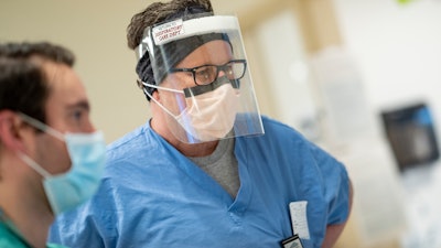Respiratory care practitioner Craig Skirvin wears a face shield at Dartmouth-Hitchcock Medical Center, Lebanon, N.H., May 1, 2020.