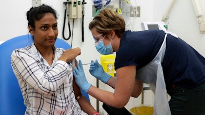 A volunteer is injected as part of a vaccine trial in a video issued by Oxford University, April 25, 2020.