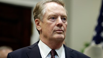 U.S. Trade Representative Robert Lighthizer listens as President Trump speaks before signing a trade agreement with Japan in the Roosevelt Room of the White House, Oct. 7, 2019.