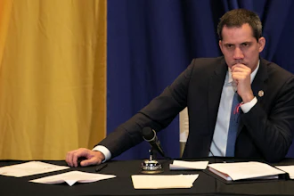 Venezuela opposition leader Juan Guaidó listens to a legislative session being held at a school in Caracas, March 4, 2020.