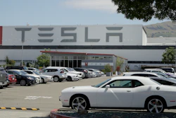 Vehicles are seen parked at the Tesla car plant.