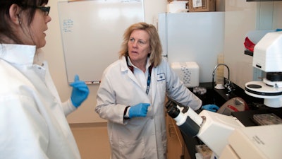 Judy Mikovits talks to a research associate at the Whittemore Peterson Institute for Neuro-Immune Disease, Reno, Nev., Feb. 28, 2011.