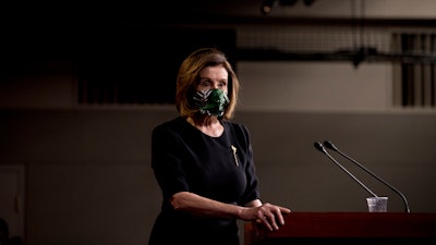 House Speaker Nancy Pelosi, D-Calif., wears a mask at the conclusion of a news conference on Capitol Hill, May 14, 2020.