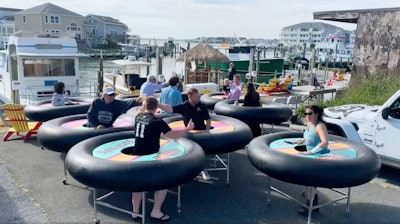 Image from video of 'bumper tables' at Fish Tales in Ocean City, Md., May 16, 2020.