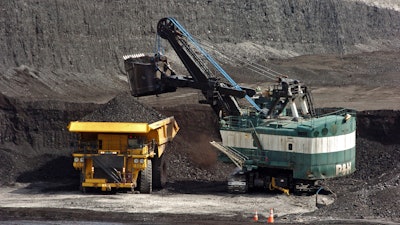 A mechanized shovel loads coal onto a haul truck at Cloud Peak Energy's Spring Creek mine near Decker, Mont., April 4, 2013.