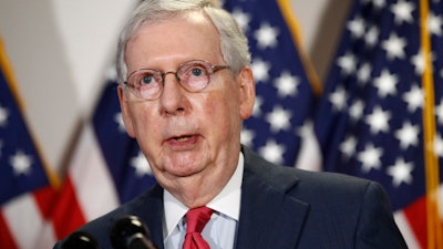 Senate Majority Leader Mitch McConnell, R-Ky., speaks with reporters after meeting with Senate Republicans on Capitol Hill, May 19, 2020.